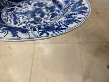A pair of Chinese blue and white lobed 'phoenix and monkey' plates, Kangxi