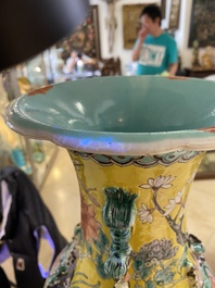 A pair of Chinese yellow-ground famille rose vases, 19th C.