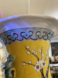 A pair of Chinese yellow-ground famille rose vases, 19th C.