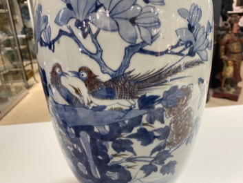 A Chinese blue, white and copper-red vase, 18/19th C.