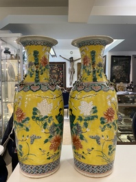 A pair of Chinese yellow-ground famille rose vases, 19th C.