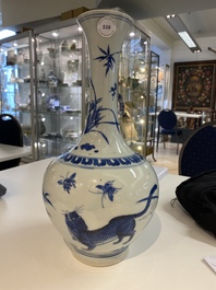 A rare Chinese blue and white bottle vase with a tiger and two butterflies, Transitional period
