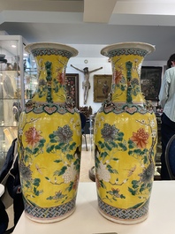 A pair of Chinese yellow-ground famille rose vases, 19th C.