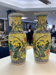 A pair of Chinese yellow-ground famille rose vases, 19th C.