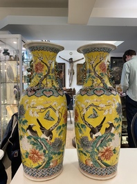 A pair of Chinese yellow-ground famille rose vases, 19th C.