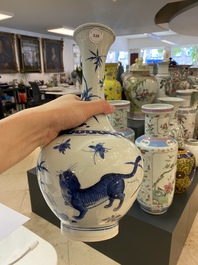 A rare Chinese blue and white bottle vase with a tiger and two butterflies, Transitional period
