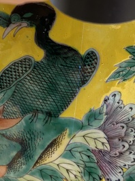 A pair of Chinese yellow-ground famille rose vases, 19th C.