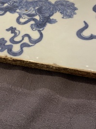 A large Chinese blue and white 'Buddhist lions' plaque, 19th C.