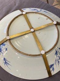 A large Chinese blue and white dish and a floral bowl, 19th C.