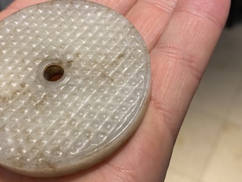 A Chinese white jade bi disc, Han