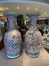 A pair of large Chinese famille rose 'dragon' vases, 19th C.