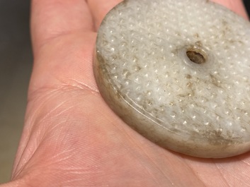 A Chinese white jade bi disc, Han