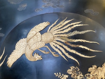 A large Japanese wooden screen with a central gilt-lacquered and ivory-inlaid panel, Meiji
