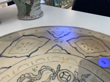 A Vietnamese or Annamese gilt-heightened blue, white and green dish with a Buddhist lion, 14/15th C.