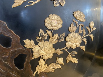 A large Japanese wooden screen with a central gilt-lacquered and ivory-inlaid panel, Meiji
