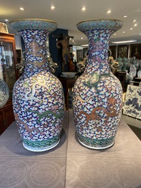 A pair of large Chinese famille rose 'dragon' vases, 19th C.