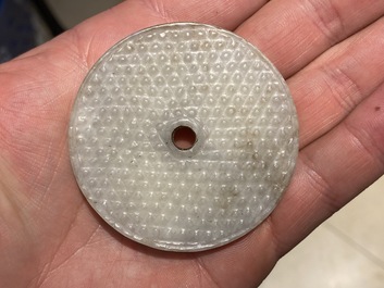 A Chinese white jade bi disc, Han