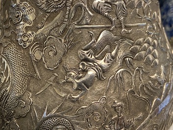 A Chinese silver teapot with birds among blossoming branches, 19th C.