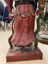 A large polychromed wooden figure of a guardian, China or Vietnam, 19th C.