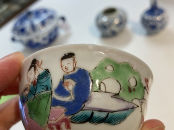 A Chinese famille rose cup and saucer with a couple on a terrace, Qianlong
