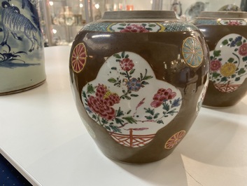 A pair of Chinese famille rose capucin brown-ground jars, Qianlong