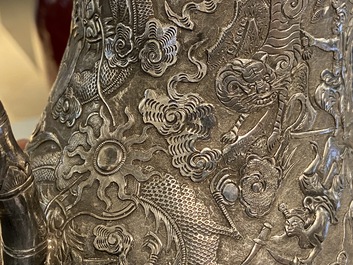 A Chinese silver teapot with birds among blossoming branches, 19th C.