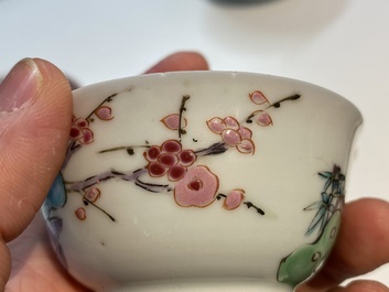 A Chinese famille rose cup and saucer with a couple on a terrace, Qianlong