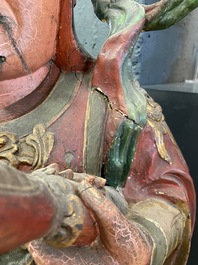 A large polychromed wooden figure of a guardian, China or Vietnam, 19th C.