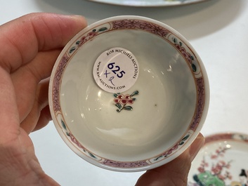 A Chinese famille rose cup and saucer with a couple on a terrace, Qianlong