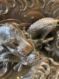 A large Japanese wooden screen with a central gilt-lacquered and ivory-inlaid panel, Meiji