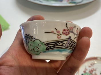 A Chinese famille rose cup and saucer with a couple on a terrace, Qianlong
