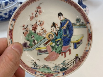 A Chinese famille rose cup and saucer with a couple on a terrace, Qianlong
