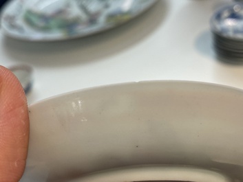 A Chinese famille rose cup and saucer with a couple on a terrace, Qianlong