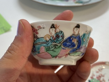 A Chinese famille rose cup and saucer with a couple on a terrace, Qianlong