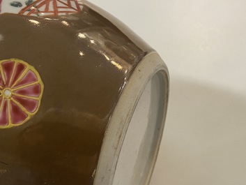 A pair of Chinese famille rose capucin brown-ground jars, Qianlong