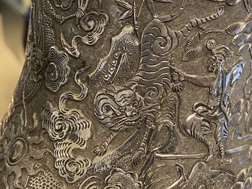 A Chinese silver teapot with birds among blossoming branches, 19th C.