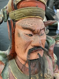 A large polychromed wooden figure of a guardian, China or Vietnam, 19th C.