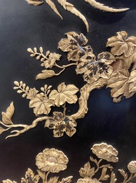 A large Japanese wooden screen with a central gilt-lacquered and ivory-inlaid panel, Meiji