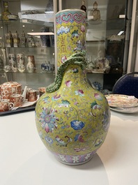 A Chinese yellow-ground famille rose bottle vase, 19th C.