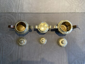 Two Vietnamese silver teapots and a sugar bowl and cover, marked Donghung, ca. 1900