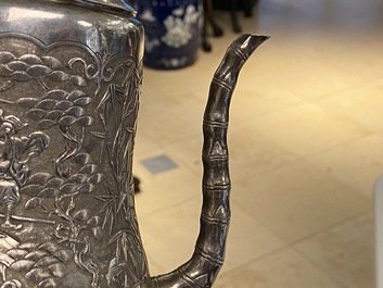 A Chinese silver teapot with birds among blossoming branches, 19th C.