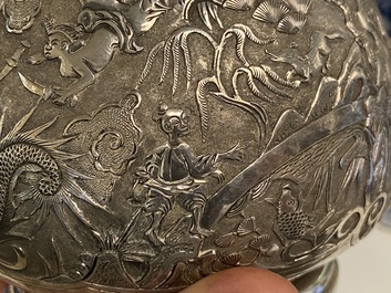 A Chinese silver teapot with birds among blossoming branches, 19th C.