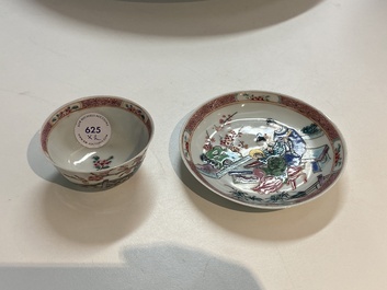 A Chinese famille rose cup and saucer with a couple on a terrace, Qianlong