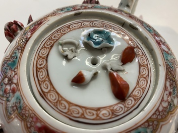 A Chinese famille rose teapot with applied floral design, Yongzheng