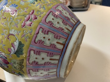 A Chinese yellow-ground famille rose bottle vase, 19th C.