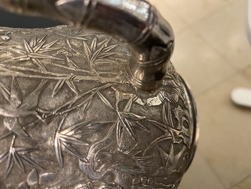 A Chinese silver teapot with birds among blossoming branches, 19th C.