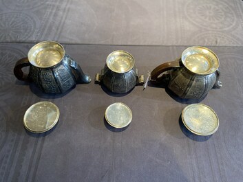 Two Vietnamese silver teapots and a sugar bowl and cover, marked Donghung, ca. 1900