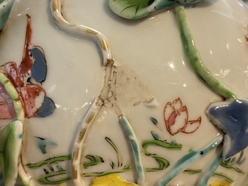 A Chinese famille rose teapot with applied floral design, Yongzheng