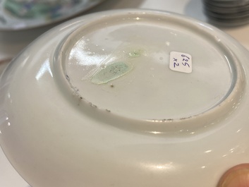 A Chinese famille rose cup and saucer with a couple on a terrace, Qianlong
