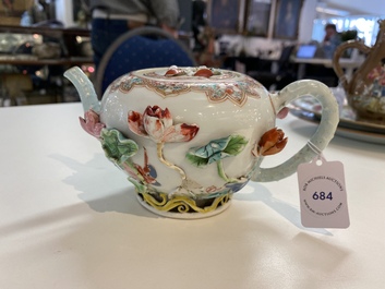 A Chinese famille rose teapot with applied floral design, Yongzheng